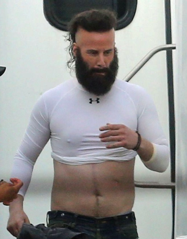 Keanu wearing a cropped top